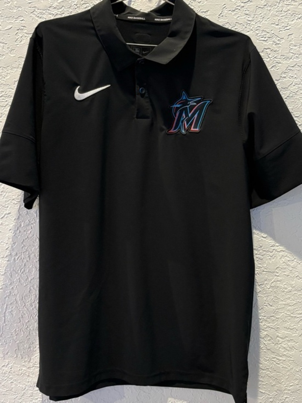 Nike Black Miami Marlins Polo with White Swoosh and Teal Accent